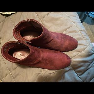 Burgundy high heeled shoes.